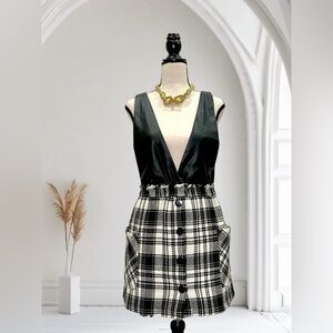 Black and white plaid mini skirt with black faux leather top.
